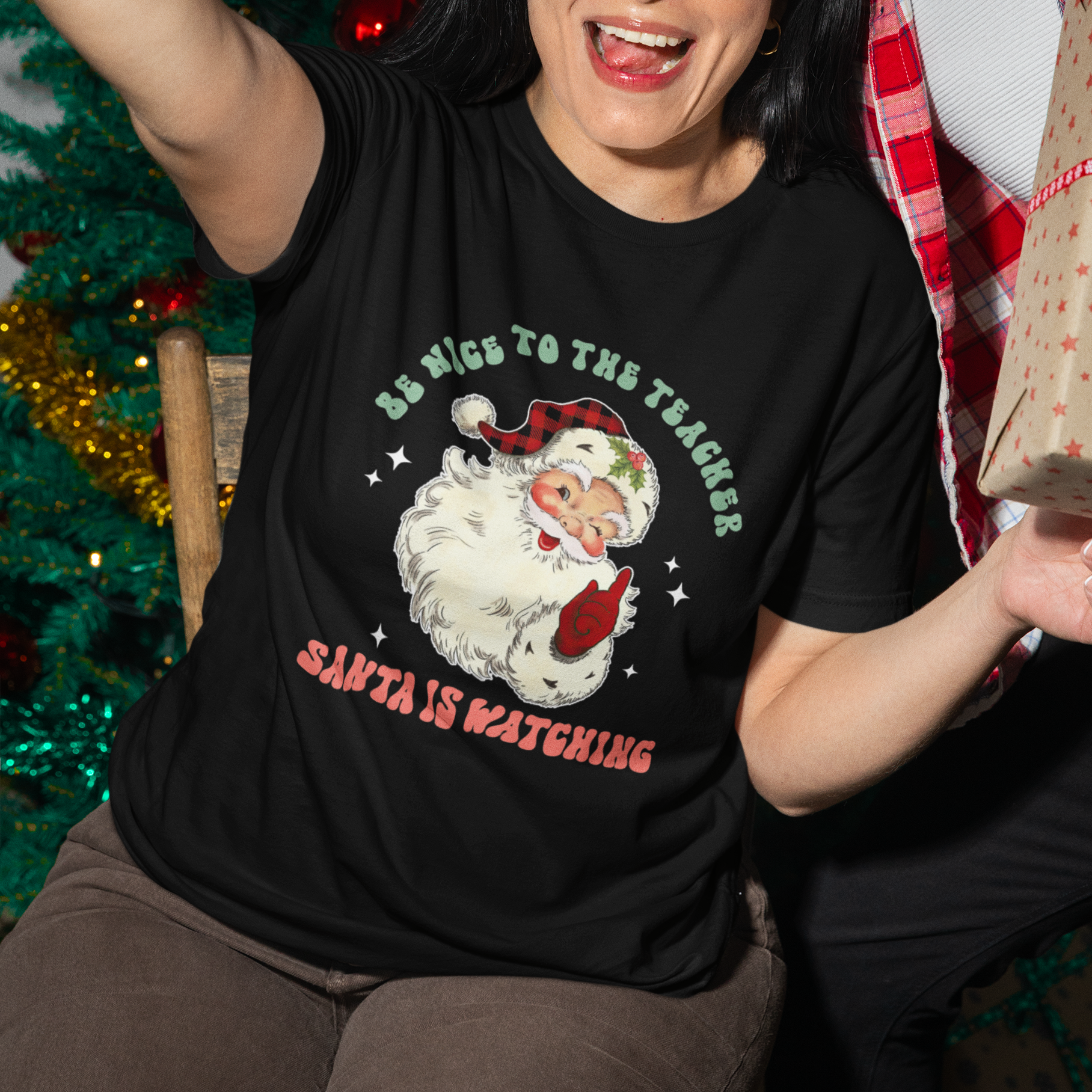 be-nice-to-the-teacher-santa-is-watching-retro-groovy-christmas-t-shirt