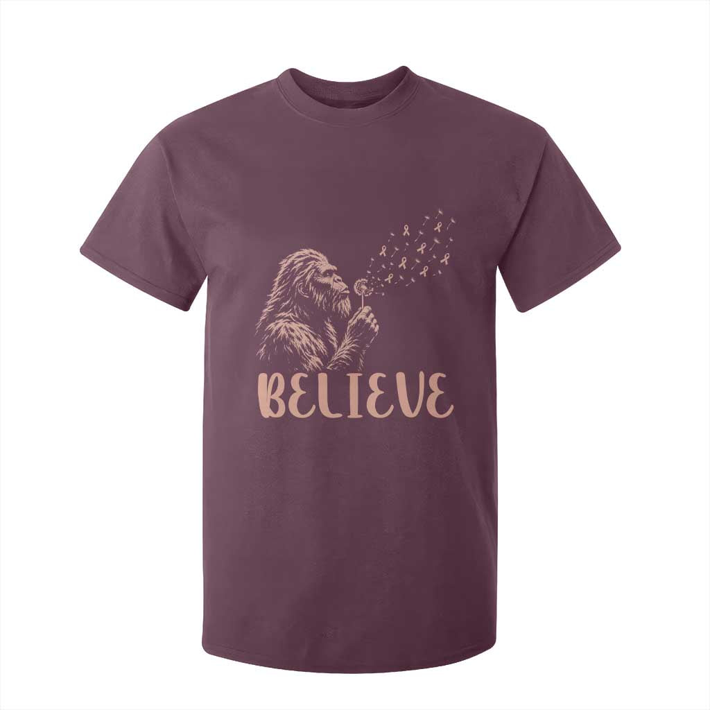 Funny Bigfoot Blowing Dandelion Flower Graphic T Shirt For Kid Believe Endometrial Cancer